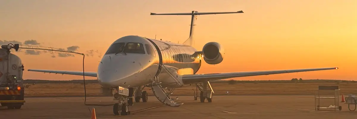 White private jet on the tarmac